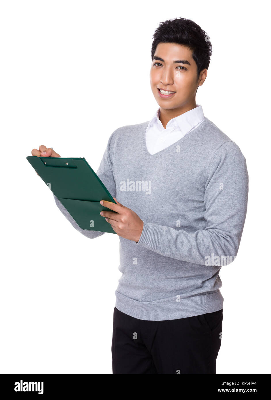 Indian businessman take note on clipboard Stock Photo - Alamy