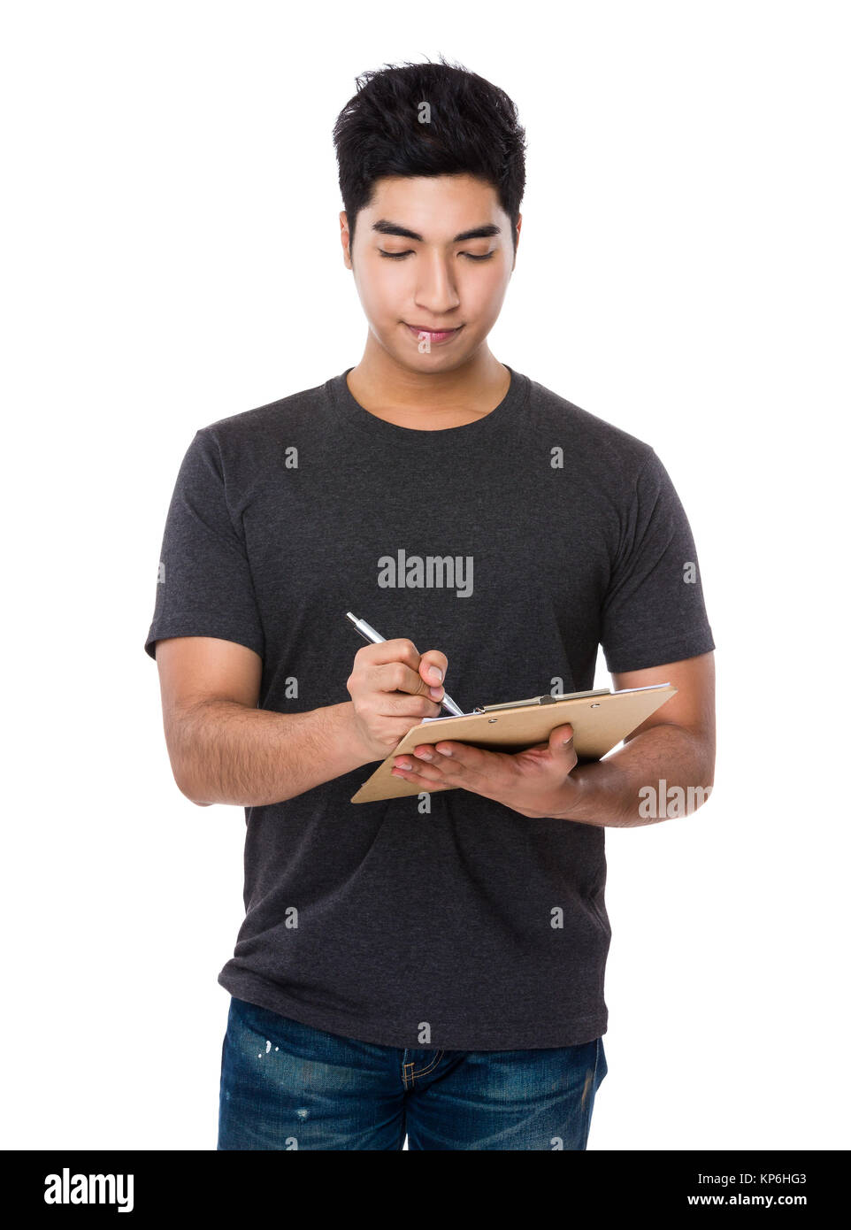 Young man take note on clipboard Stock Photo - Alamy