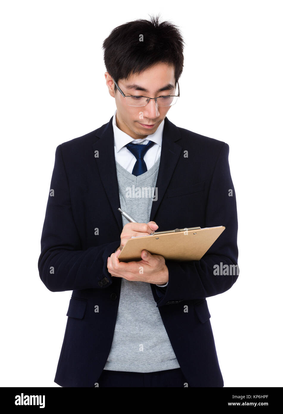 Young businessman write on clipboard Stock Photo - Alamy