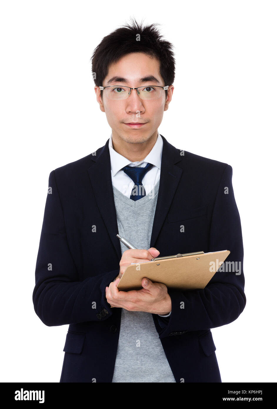 Asian businessman take note on clipboard Stock Photo - Alamy