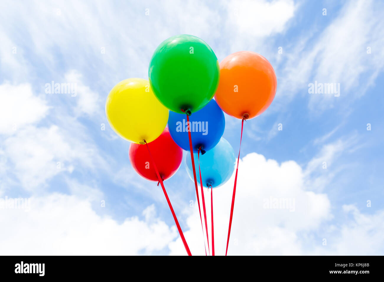 A group of colorful balloons with blue sky background Stock Photo - Alamy