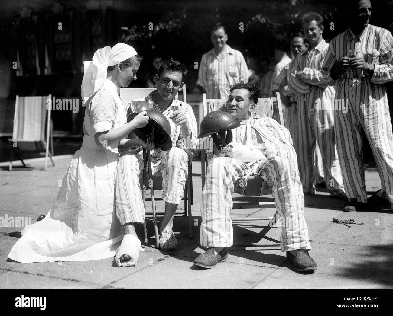 British nurse comforting wounded soldiers following the evacuation of troops Dunkirk in 1940 Stock Photo