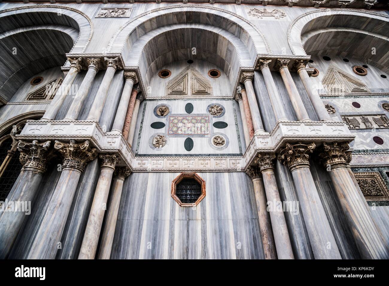 Detail of the exterior of the Basilica di San Marco (St. Mark's Basilica) with emphasis on the marble, columns, and ornamentation. Piazza San Marco, Stock Photo