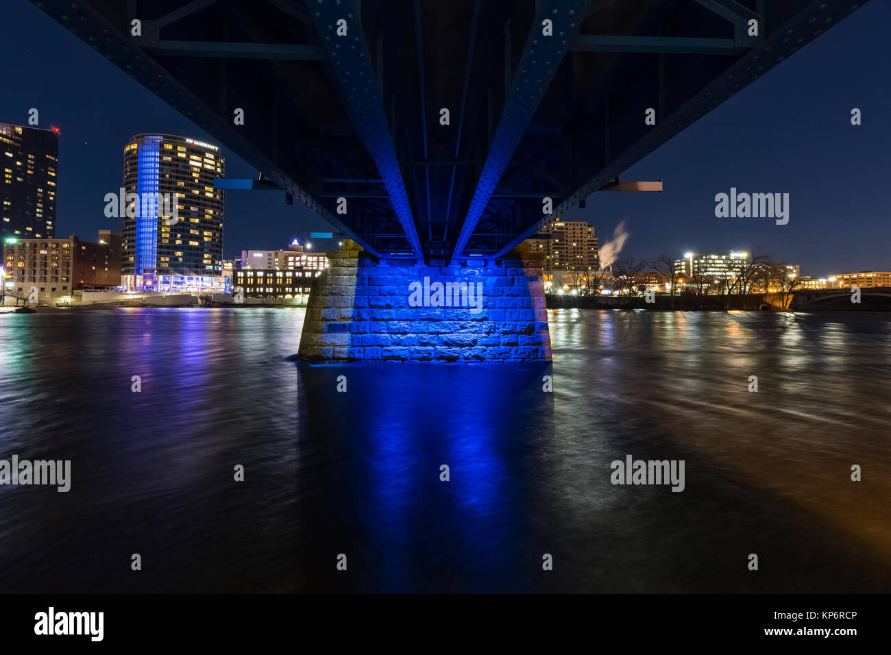 Blue Bridge at night, reflecting off the Grand River in Grand Rapids, Michigan, USA Stock Photo