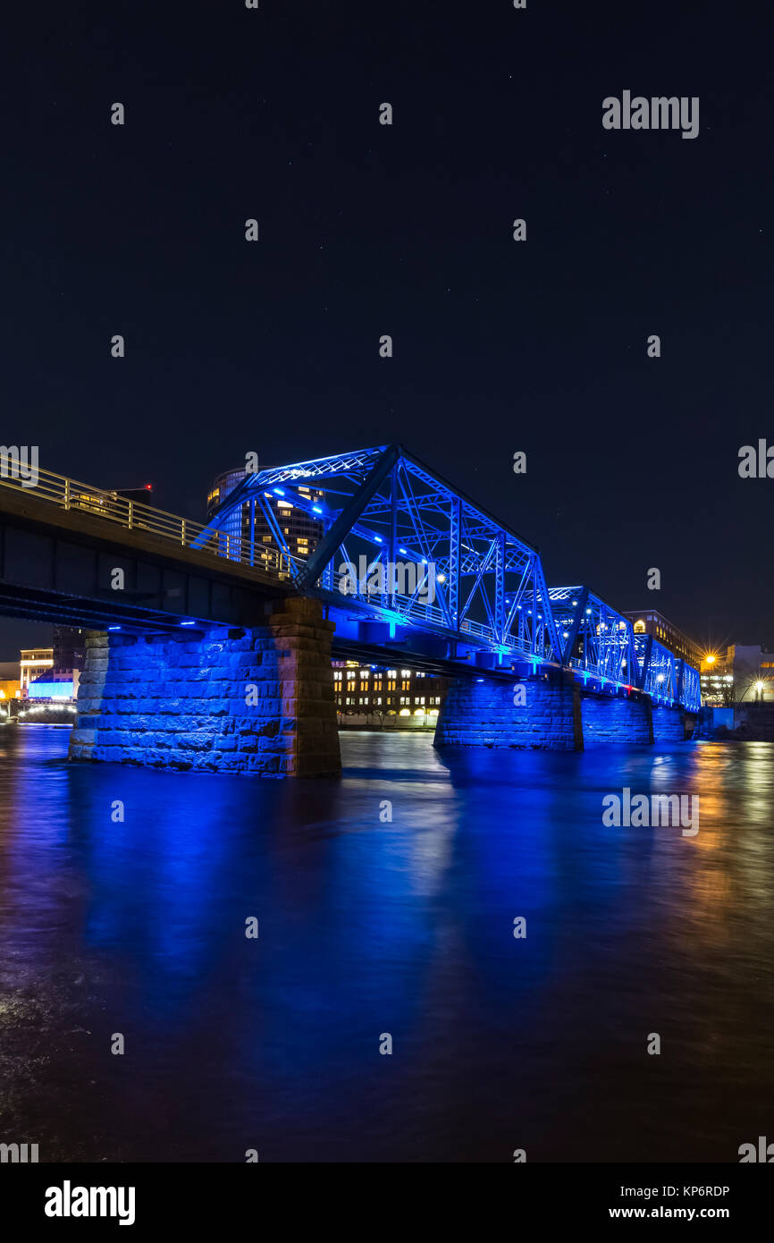 Blue Bridge at night, reflecting off the Grand River in Grand Rapids, Michigan, USA Stock Photo