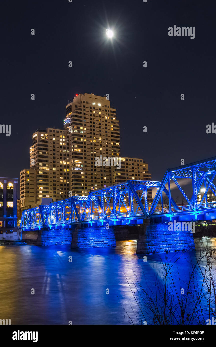 Moon with the Blue Bridge reflecting off the Grand River, viewed at night in Grand Rapids, Michigan, USA Stock Photo