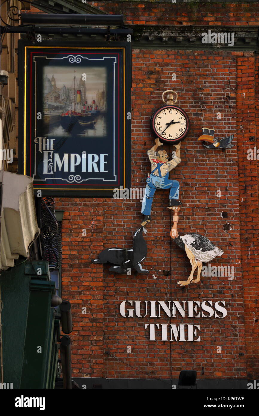 The Empire pub sign with Guinness sign behind it on O'Neill's bar. In Liverpool city centre, Liverpool, UK Stock Photo