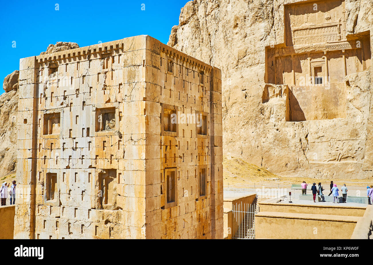 NAQSH-E RUSTAM, IRAN - OCTOBER 13, 2017: The rectangular Ka'ba-ye Zartosht tower with mausoleum of Darius II on the background, Naqsh-e Rustam Necropo Stock Photo