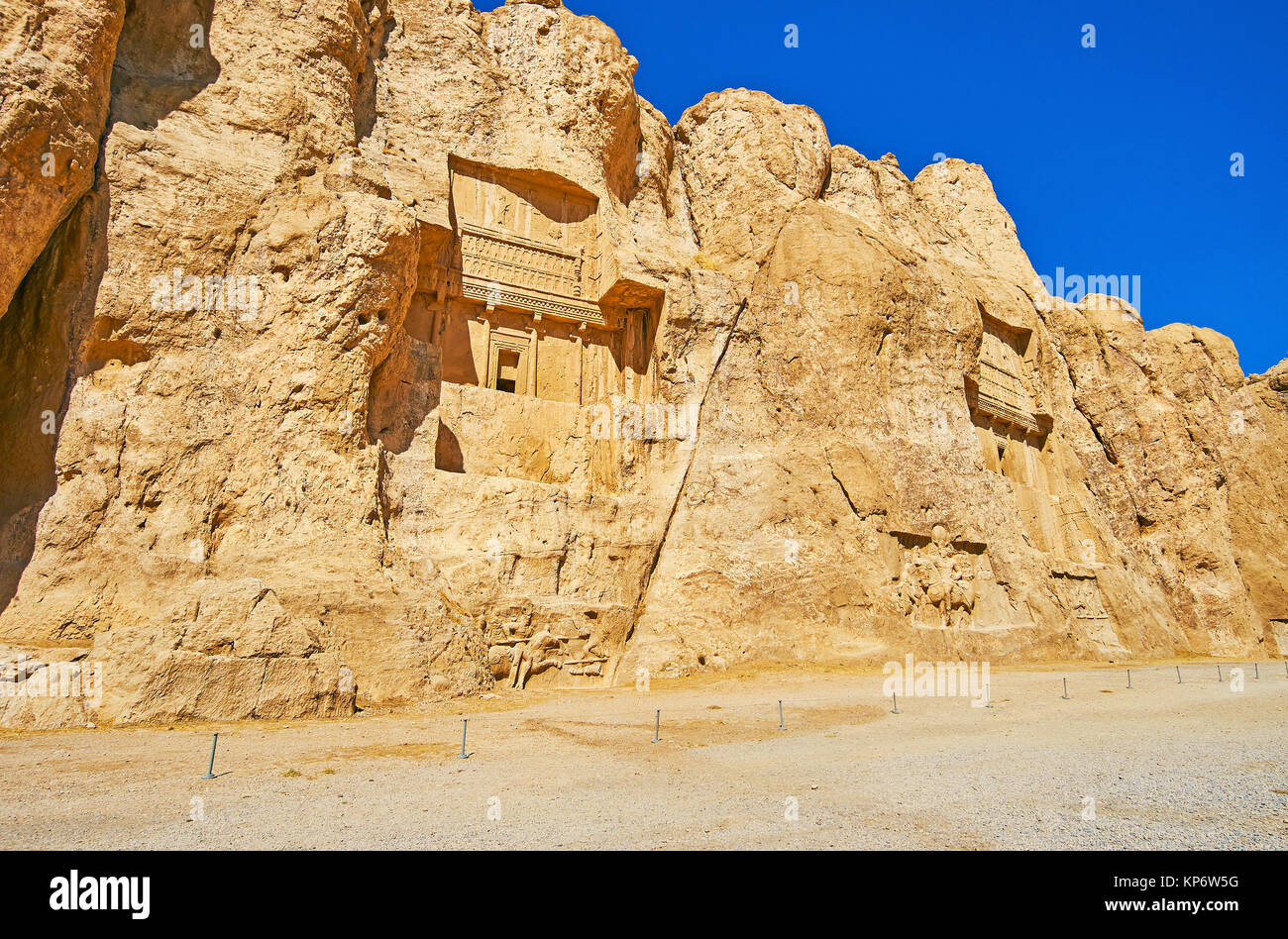 Archaeological zone of Naqsh-e Rustam Necropolis is the famous tourist destination with preserved ancient tombs, cut in rocky cliff, Iran. Stock Photo
