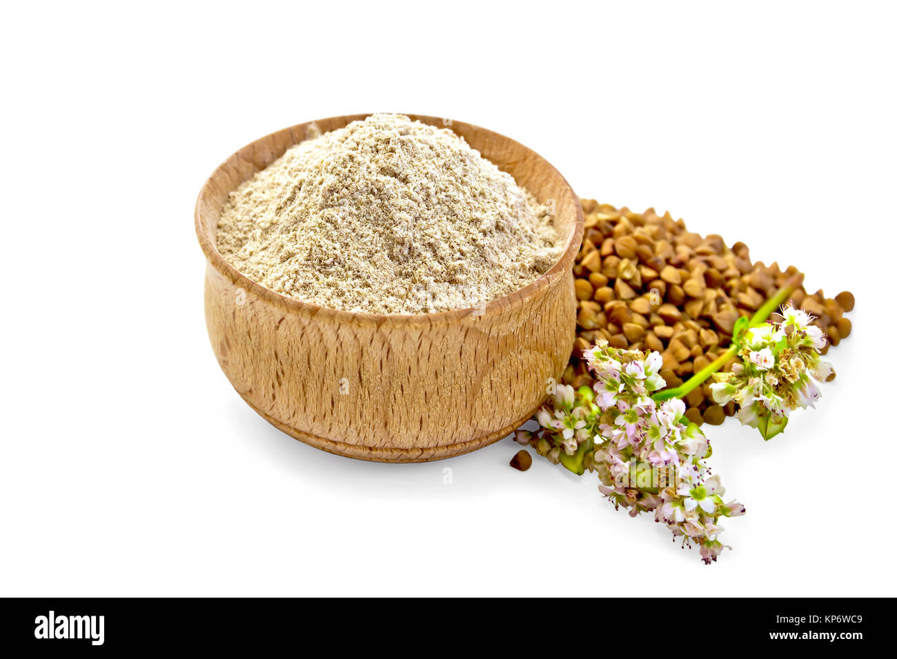 Flour buckwheat in bowl with cereals and flower Stock Photo