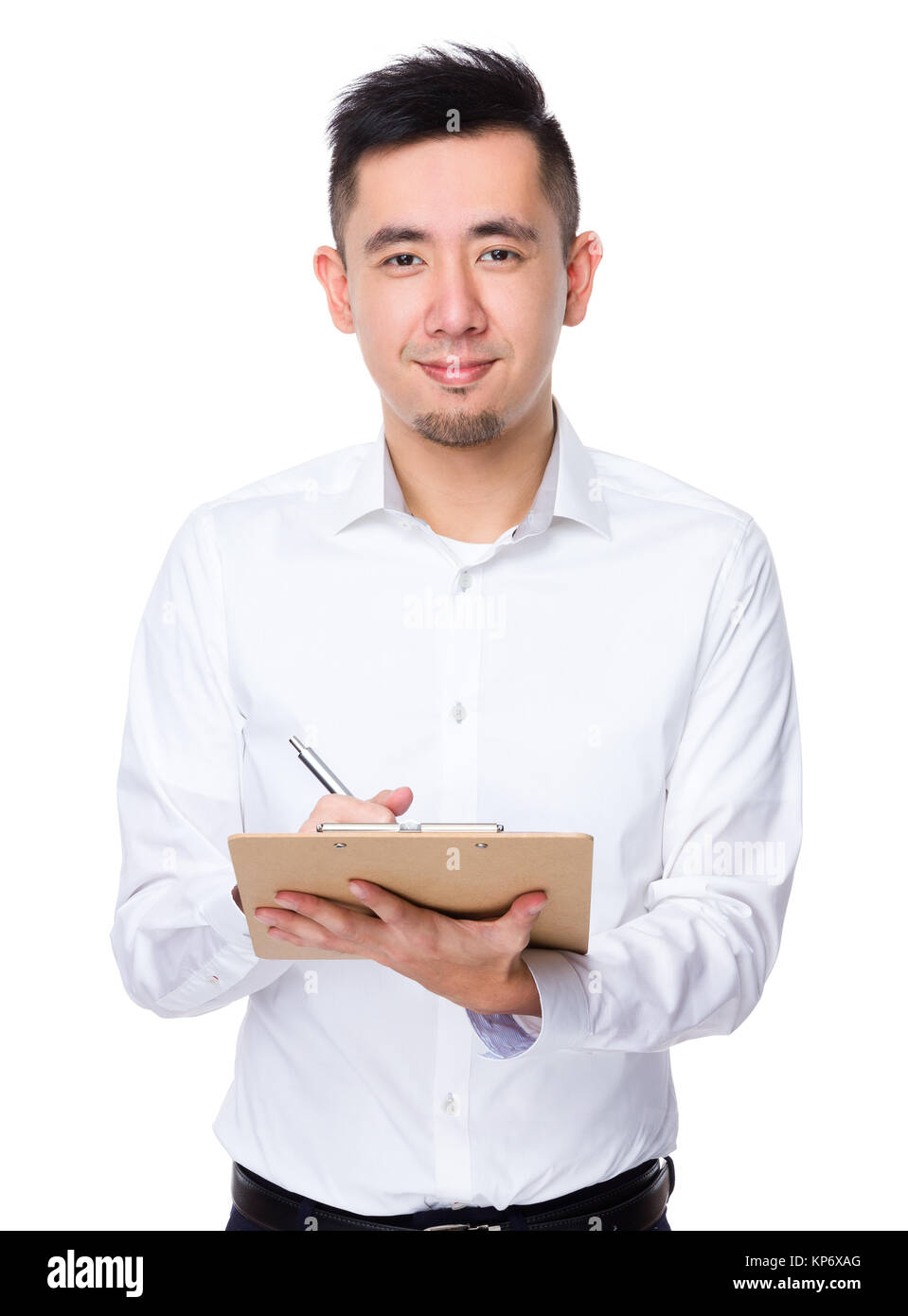 Asian Young Businessman take note on clipboard Stock Photo - Alamy