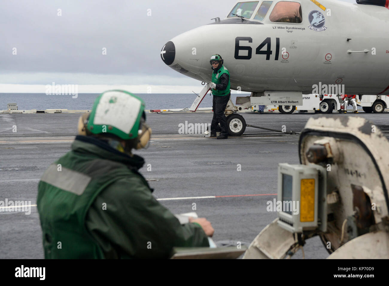 Aviation Boatswain's Mate (Equipment) 3rd Class Zachary Kummer, left, and Aviation Boatswain's Mate (Equipment) 2nd Class Jared Midgett prepare an E-2C Hawkeye, assigned to the 'Greyhawks' of Carrier Airborne Early Warning Squadron (VAW) 120, for launch from the flight deck aboard USS Harry S. Truman (CVN 75). Truman is currently underway conducting carrier qualifications in preparation for future operations. (U.S. Navy Stock Photo