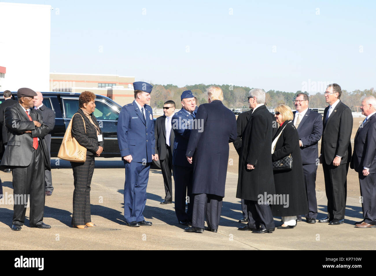 President Trump is greeted by Col Barry A. Blanchard, 172d Airlift Wing Commander (right) and Col Tommy F. Tillman, Vice Commander, 172d AW, after arriving at Thompson Field in Jackson, Mississippi.  Trump was in Jackson for the grand opening of the Civil Rights Museum. Joining 172d AW personnel in the presidential greeting line were Mississippi Governor Phil Bryant, his wife Deborah,   Mississippi Third Congressional District Representative, Gregg Harper (second from right), U.S. Senator Roger Wicker (far right).  Charles Evers (far left) and Reena everes Everette (second from left) Stock Photo