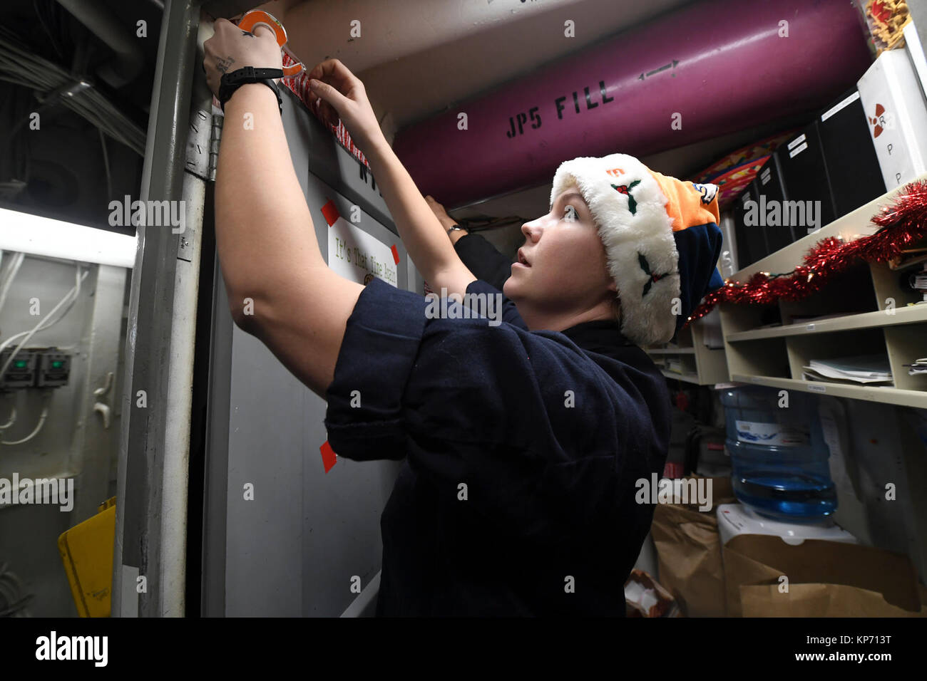 Machinist’s Mate (Nuclear) 1st Class Jessica Pickett decorates an ...