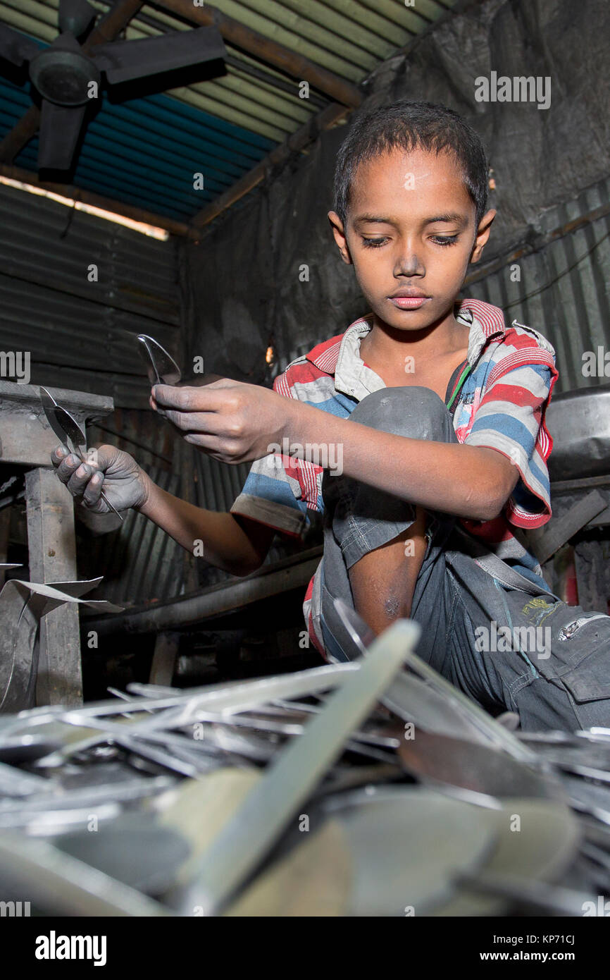 A child labor working SpoonMaking Factory near of Burigonga River at