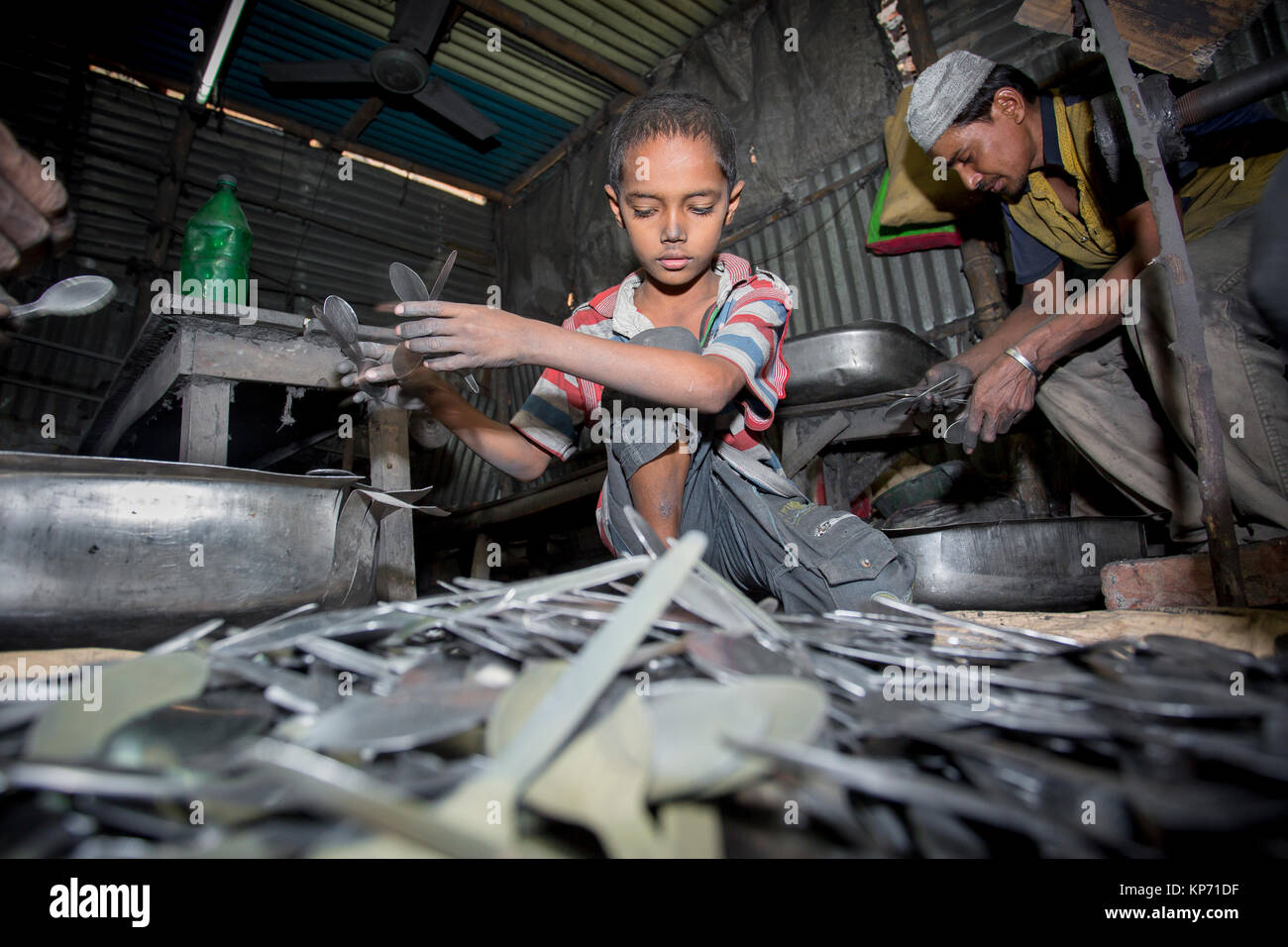 A child labor working SpoonMaking Factory near of Burigonga River at
