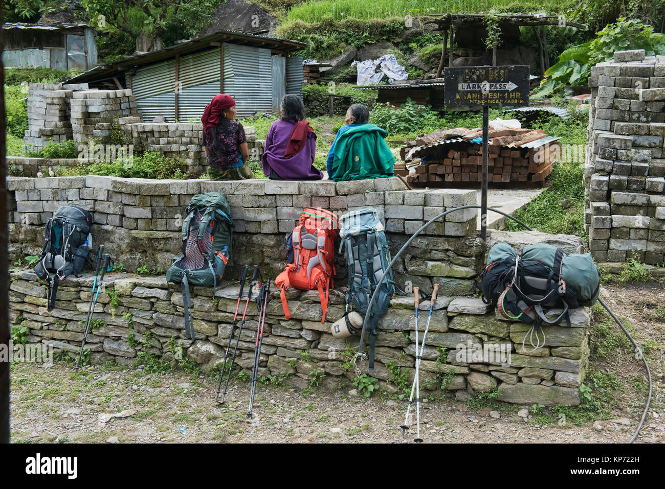 Backpacks and old women, Manaslu Circuit Trek, Nepal Stock Photo