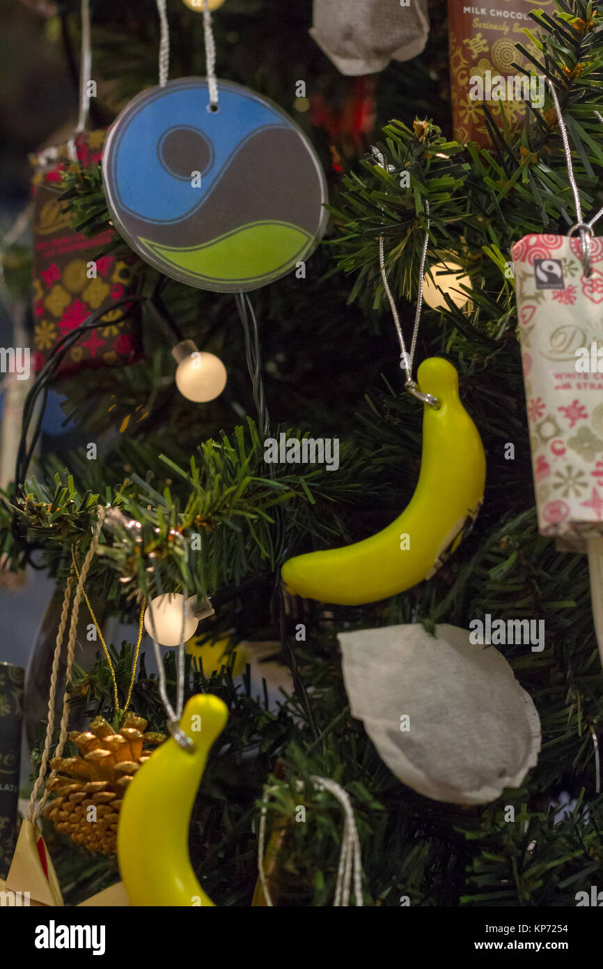 Fair-Trade themed decorations on a Christmas tree. On display at Totnes Methodist Church, Totnes, Devon, UK Stock Photo