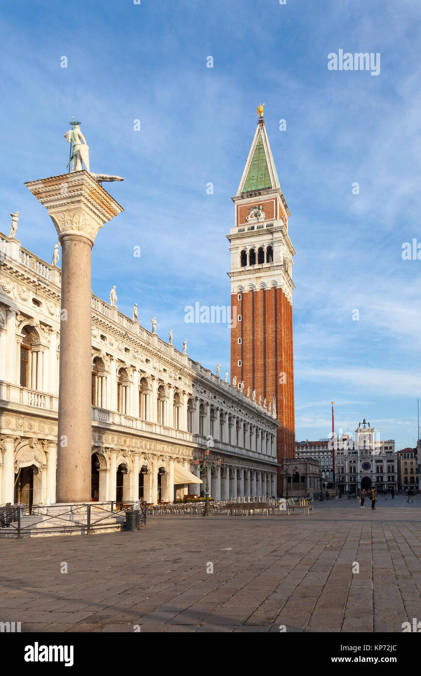 The Campanile of Basilica San Marco and the Biblioteca Nazionale Marciano  in Piazza San Marco at sunrise during golden hour, Venice, Veneto, Italy Stock Photo
