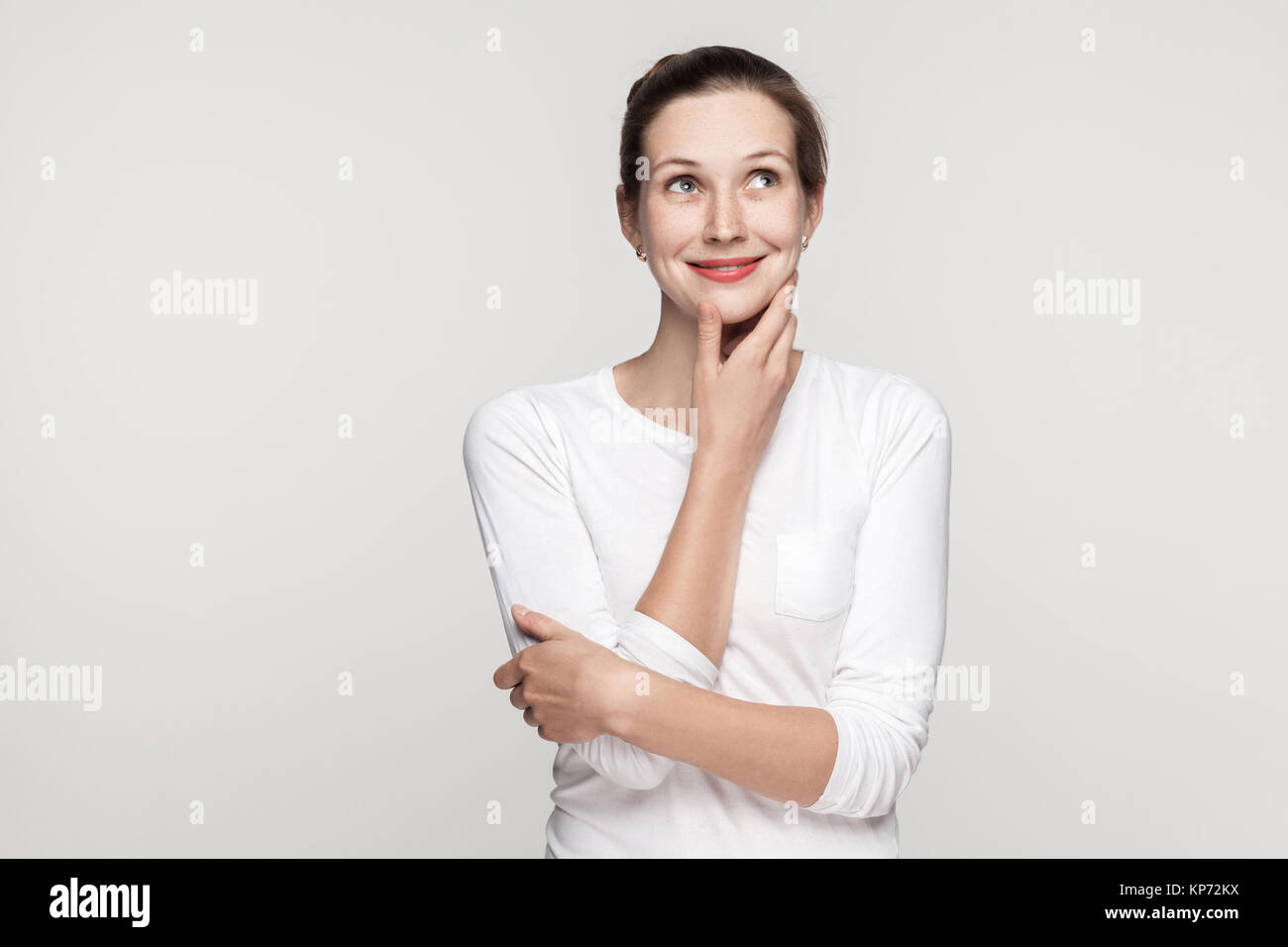 Hands on chin girl thinking hi-res stock photography and images - Alamy