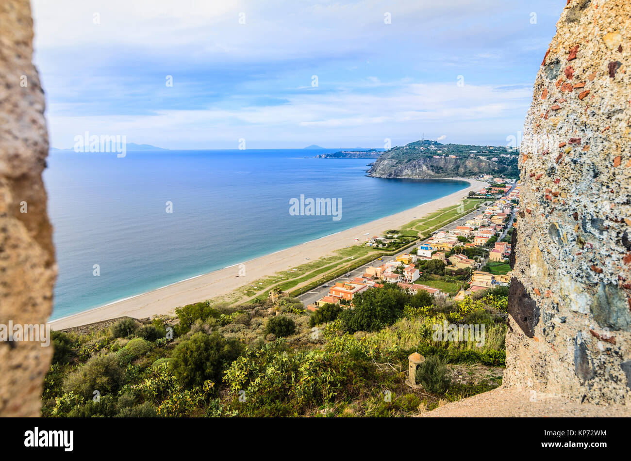 Defenses of the Norman castle of milazzo coastline with beaches of the Tyrrhenian Sea and on the horizon you can get to see the outline of the Aeolian Stock Photo