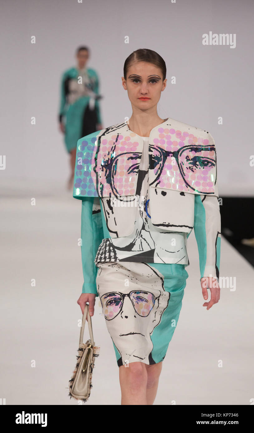 Fashion graduate Emma Guilfoyle of the University of Central Lancashire incorporated images of Prime Ministers Churchill, John Mayor (with Edwina Currie) and Margaret Thatcher into her collection. Graduate Fashion Week 2012 at London's Earl's Court. Stock Photo