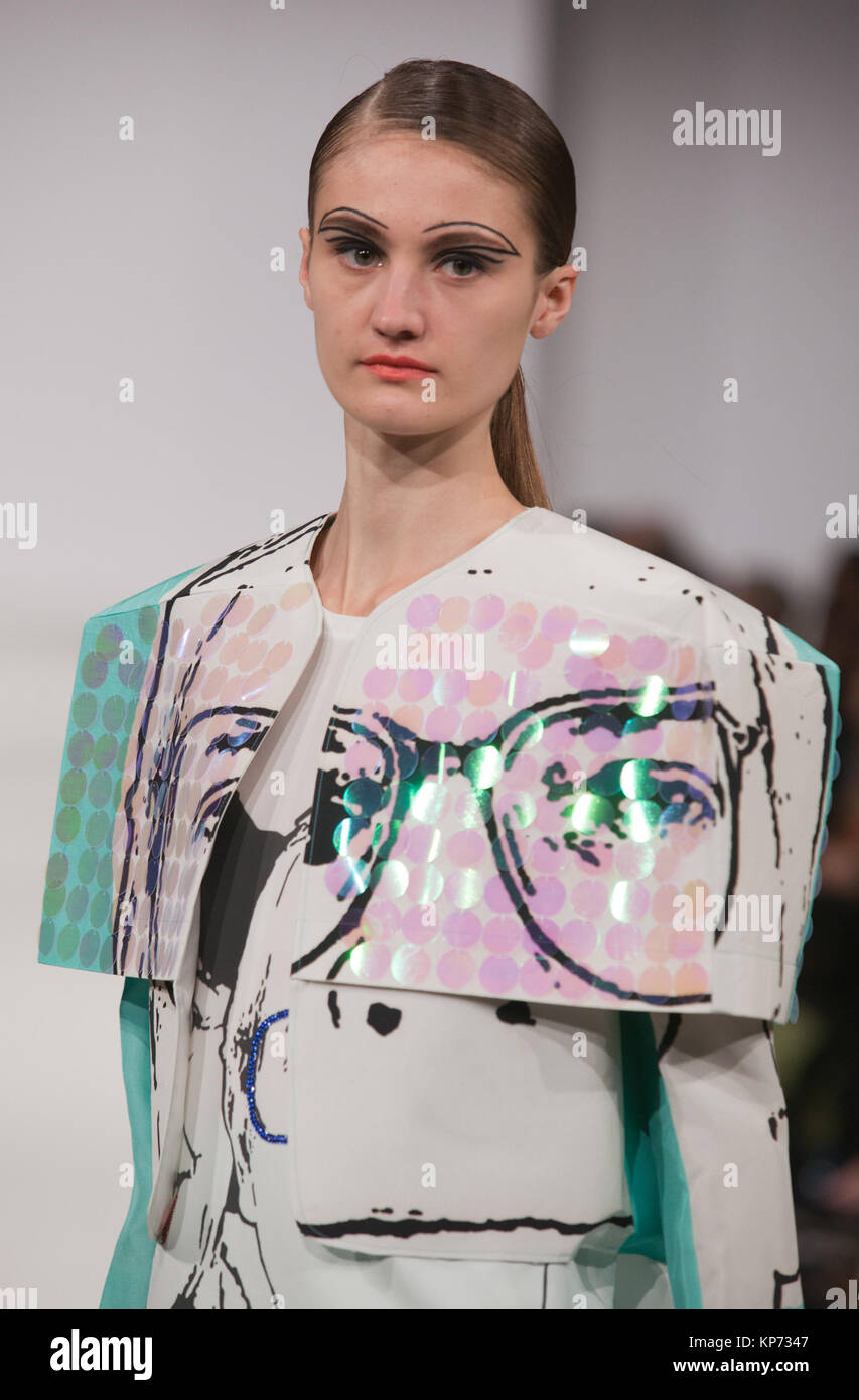 Fashion graduate Emma Guilfoyle of the University of Central Lancashire incorporated images of Prime Ministers Churchill, John Mayor (with Edwina Currie) and Margaret Thatcher into her collection. Graduate Fashion Week 2012 at London's Earl's Court. Stock Photo