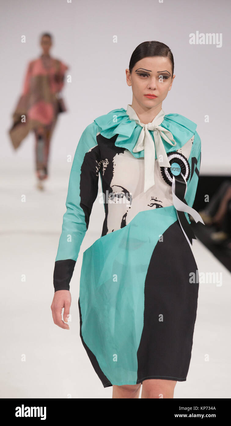 Fashion graduate Emma Guilfoyle of the University of Central Lancashire incorporated images of Prime Ministers Churchill, John Mayor (with Edwina Currie) and Margaret Thatcher into her collection. Graduate Fashion Week 2012 at London's Earl's Court. Stock Photo