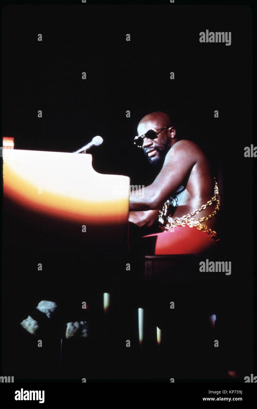 R&B and Soul Singer Isaac Hayes performs on his piano at the Push Black Expo in 1973, an event sponsored by Jesse Jackson's Push Organization Stock Photo
