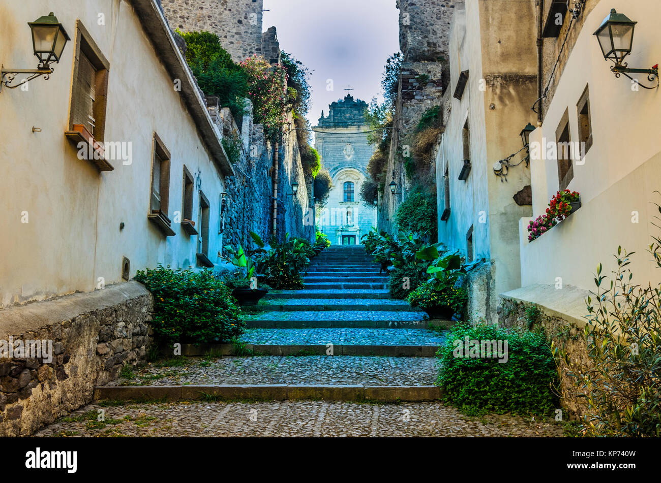 Stairways in a street on the way up and on top the main church of the island of lipari italy Stock Photo