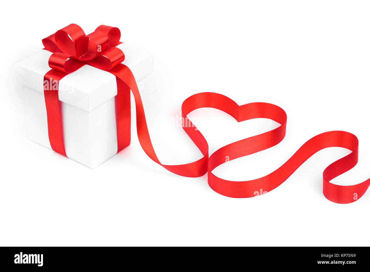 White boxes with red ribbons and decorative heart isolated on white ...
