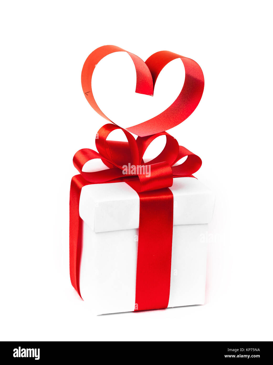 White boxes with red ribbons and decorative heart isolated on white