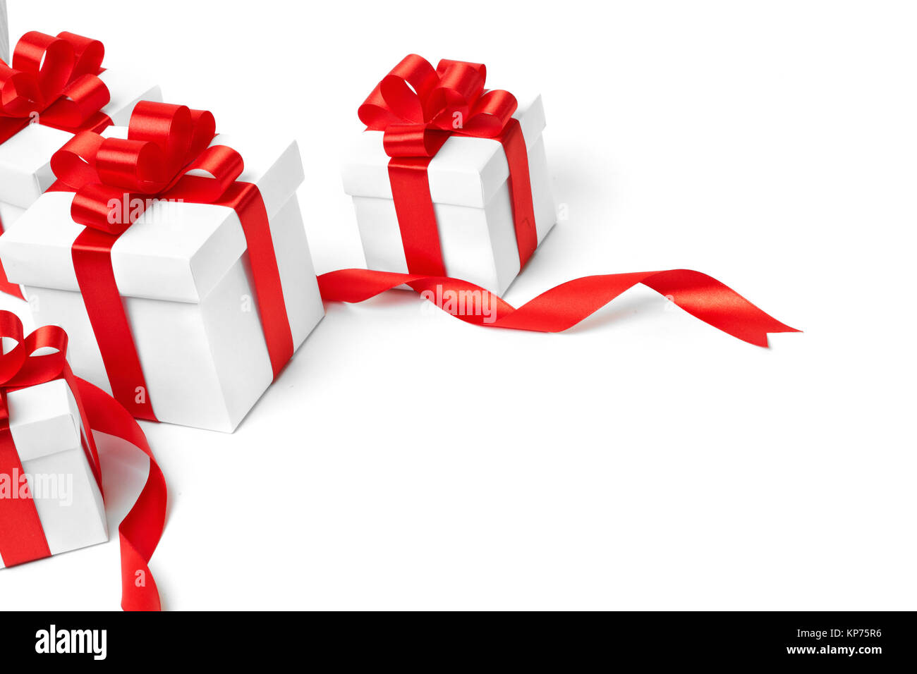 White gift box with red ribbon bow and christmas balls around, isolated ...
