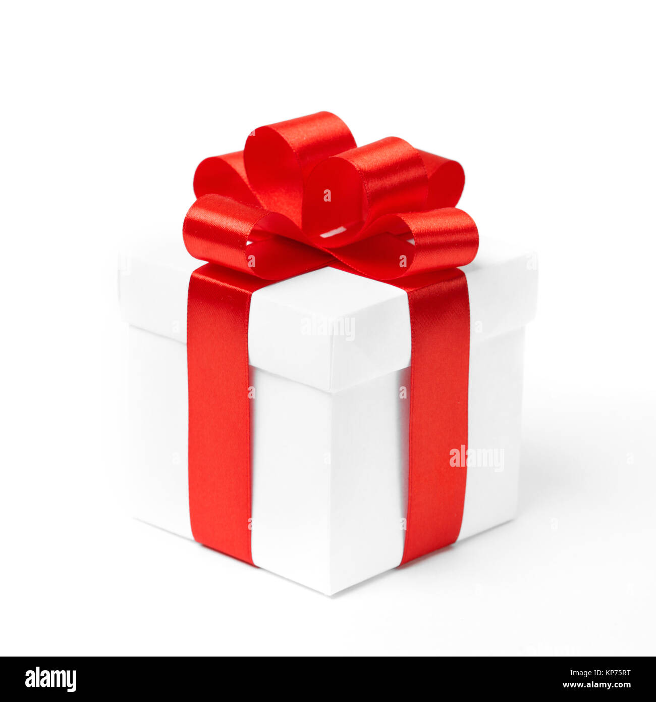 White gift box with red ribbon bow, isolated on white Stock Photo - Alamy