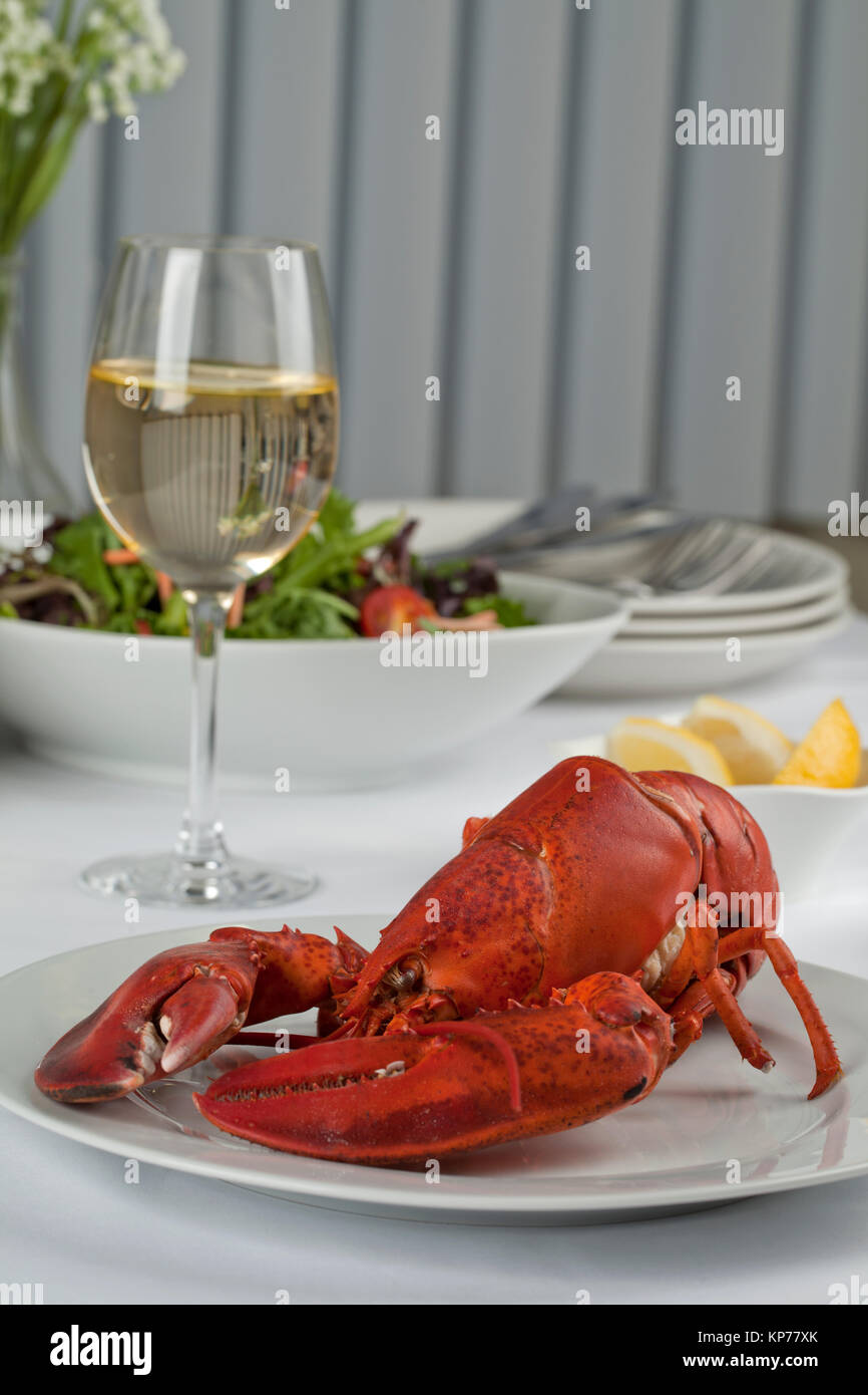 dinner table with lobster and wine Stock Photo Alamy