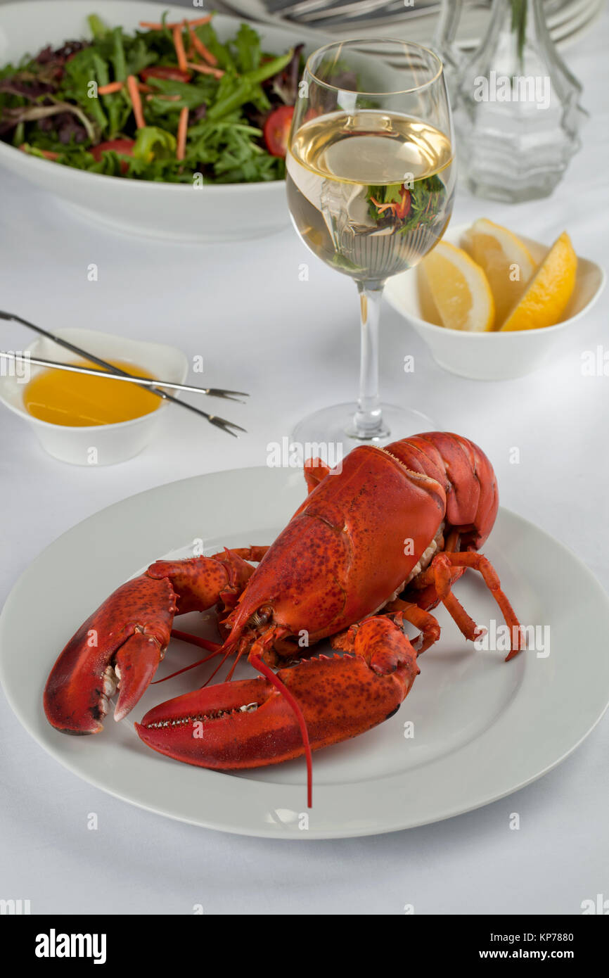 lobster dinner with wine and vegetable salad Stock Photo Alamy