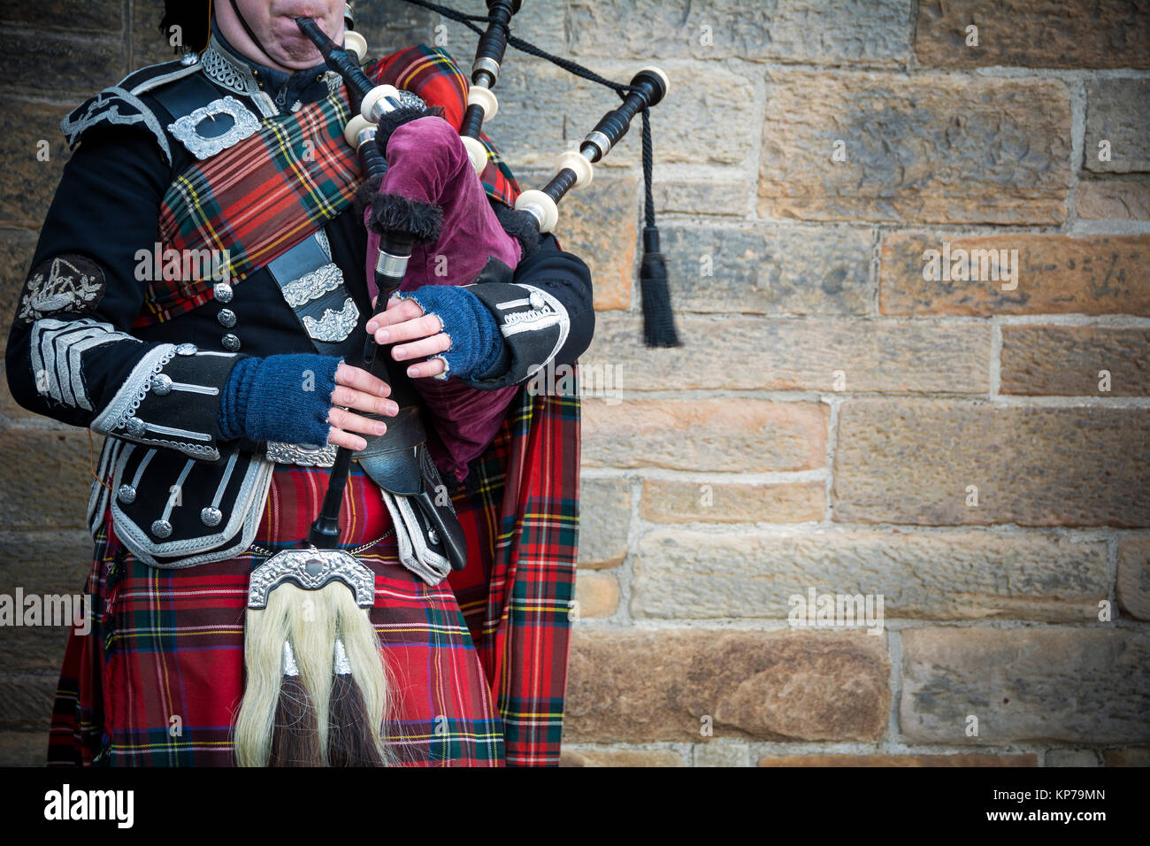 Playing the bagpipes on streets of Edinburgh Stock Photo