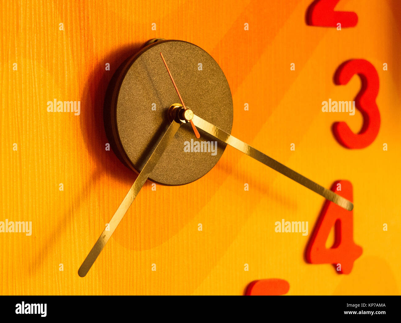 large wall clock with colorful numbers, close up Stock Photo Alamy