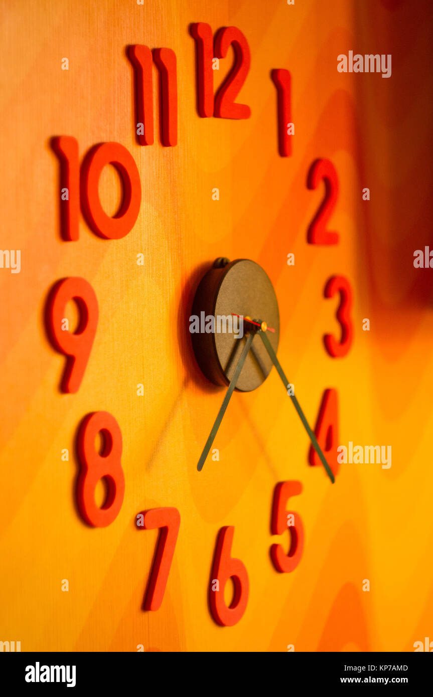 large wall clock with colorful numbers, close up Stock Photo Alamy