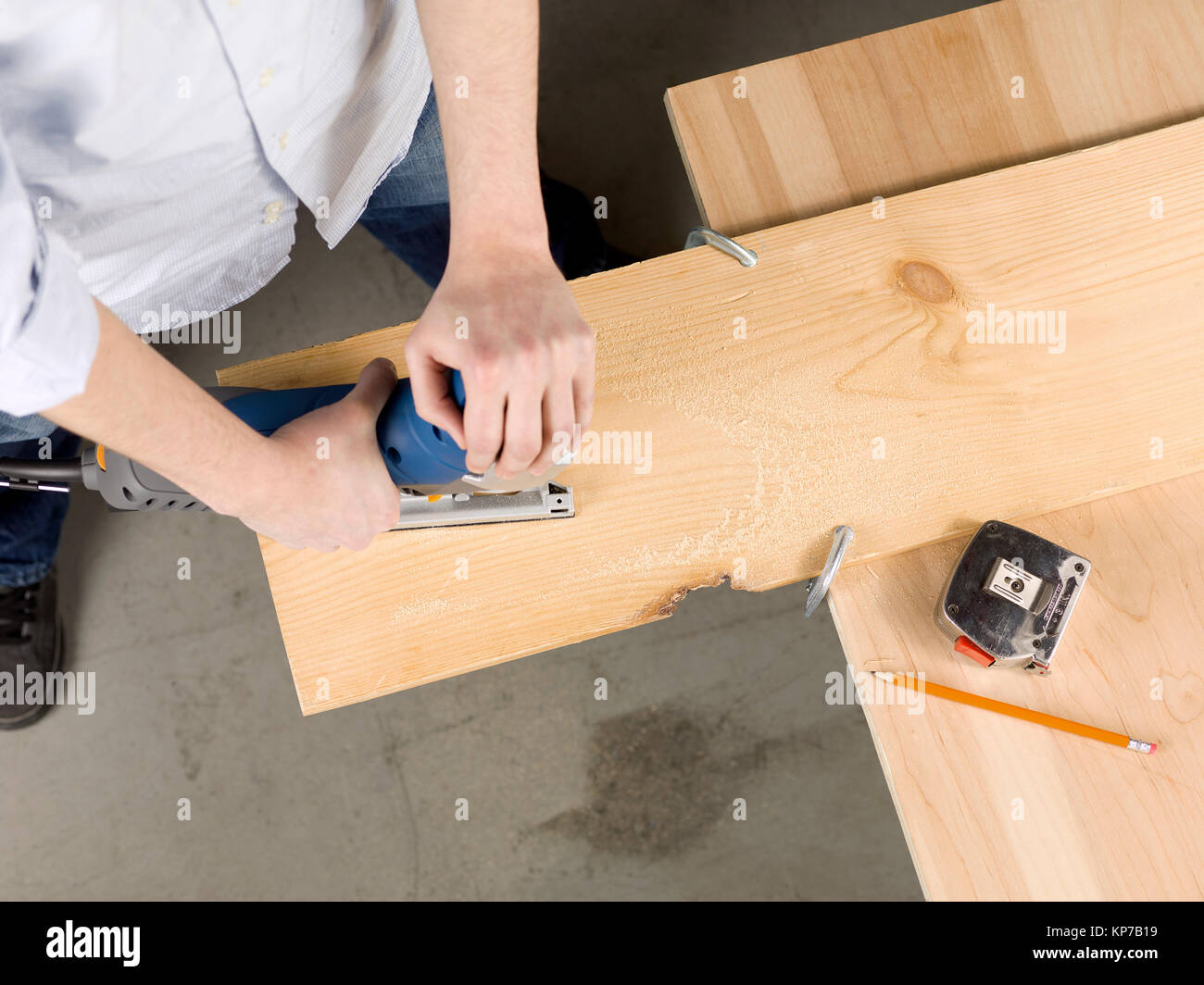 cutting a piece of wood using jigsaw Stock Photo Alamy