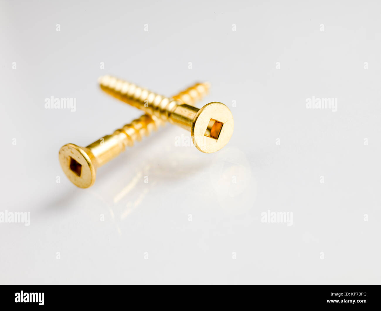 two gold screws Stock Photo Alamy