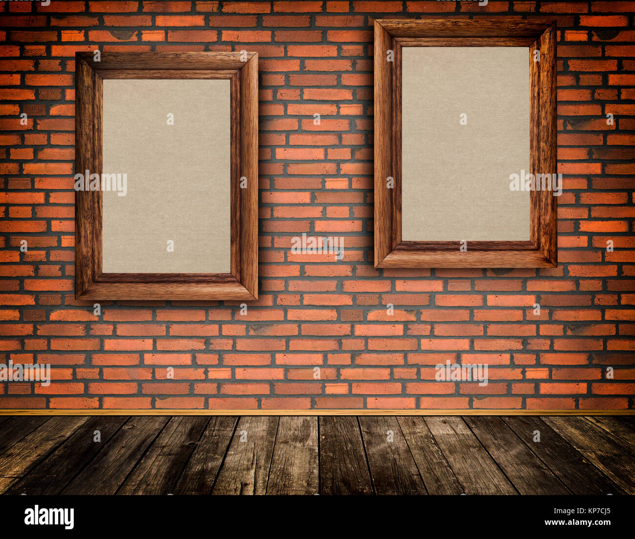 Old-fashioned frames on a bricks wall and old wooden floor. Natural material for the design. Stock Photo