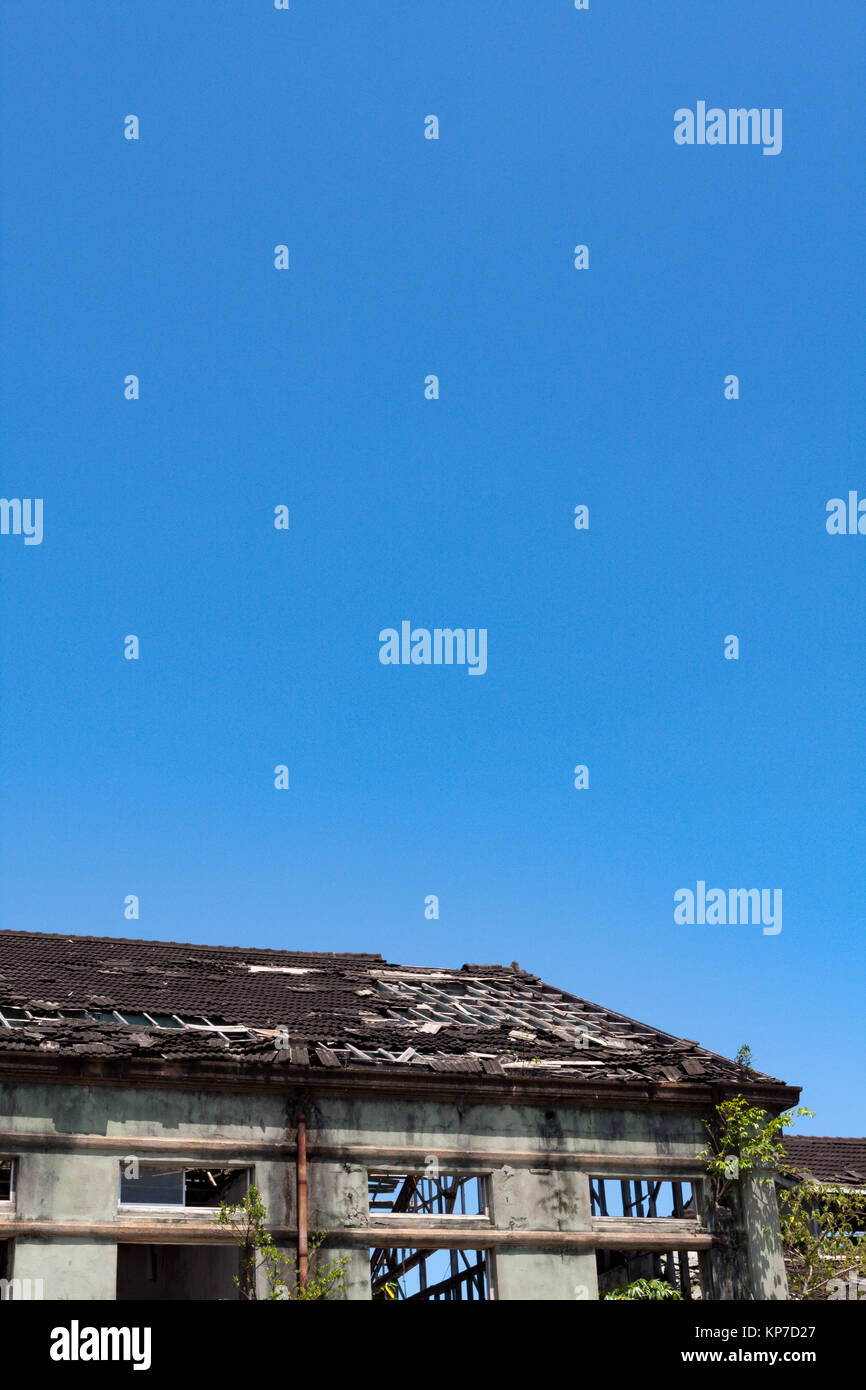 Old abandoned, ruined industry, factory, warehouse; broken and destroyed roof, exterior view, Hualien, Taiwan Stock Photo