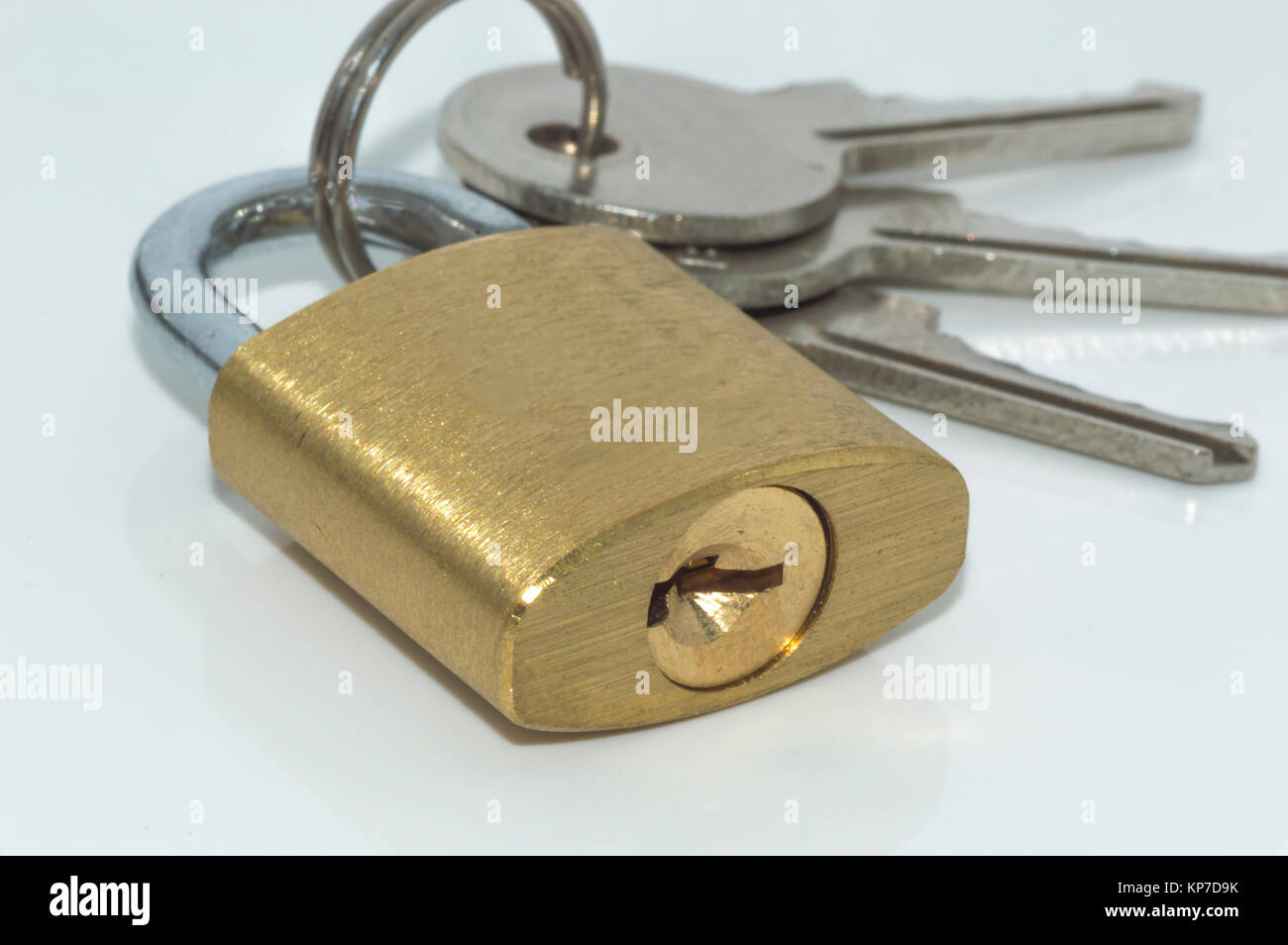 Padlock and key with white background Stock Photo - Alamy