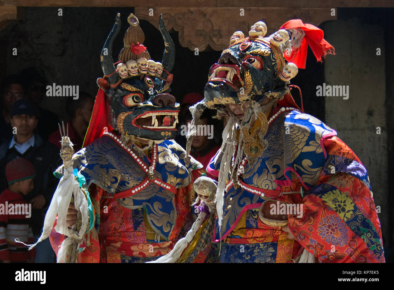 Two Buddhist monks in ancient masks Monsters and bright ritual ...