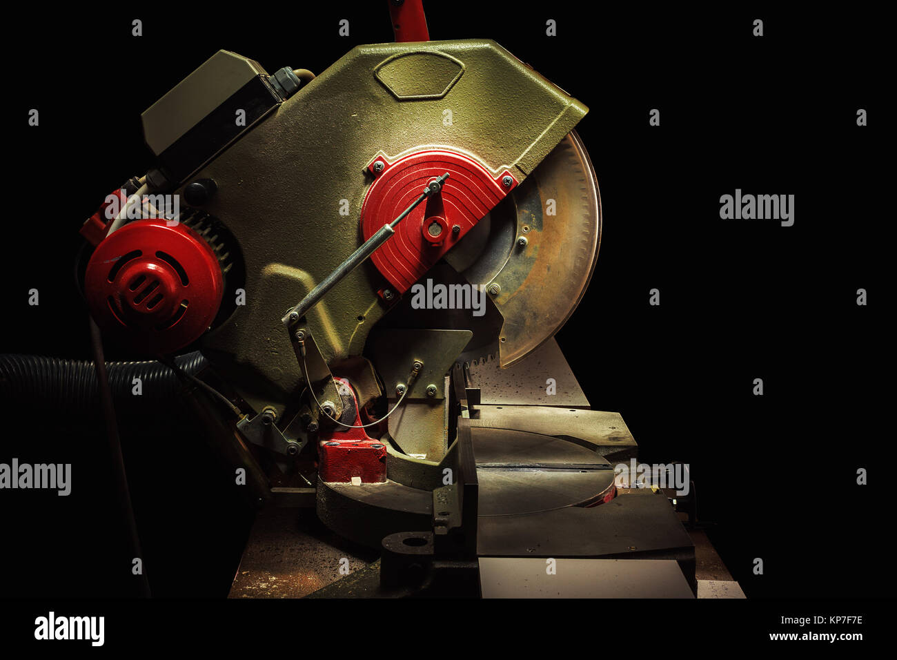 Used circular saw on black background, closeup of details. Stock Photo