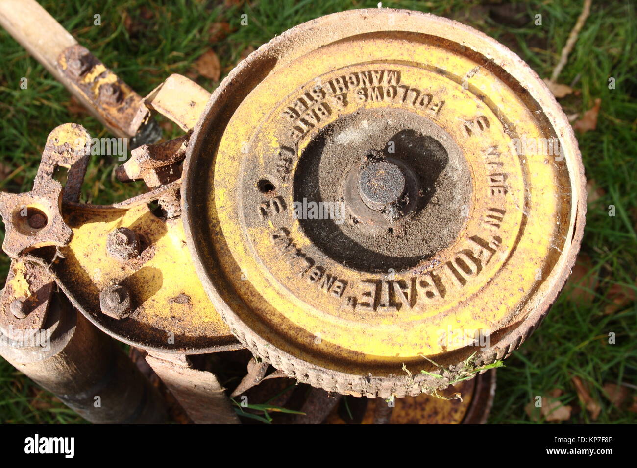 Old Hand push lawn mover, wheel that moves its blade round, and shows company detail Stock Photo