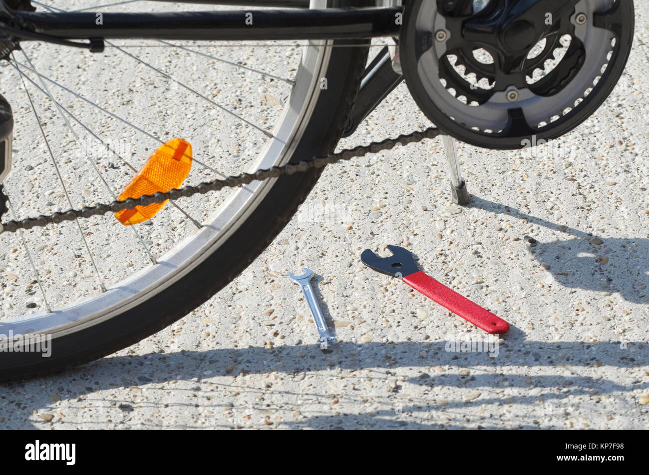 Black Bicycle Closeup with Cone Spanner Wrench Tools Stock Photo