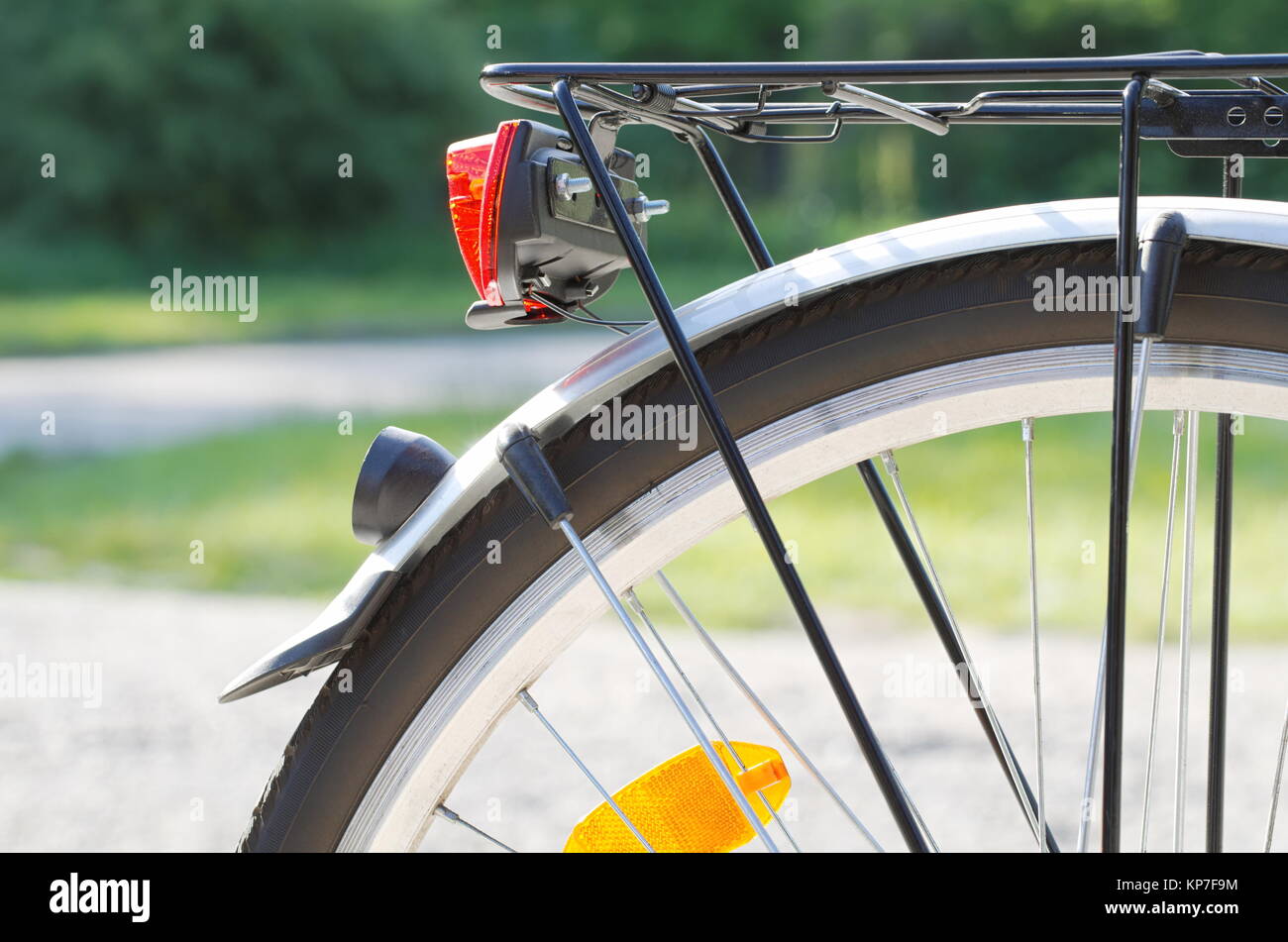 Rear Bicycle Wheel with  Reflector and Light Closeup Stock Photo