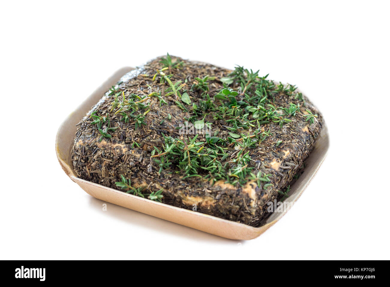 Corsican traditional square goat cheese with seasonning herbs on white background Stock Photo